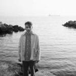 FRANCESCO DI BELLA | sPAZIO211 (TO) May be a black-and-white image of 1 person, overcoat and ocean