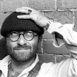 Scandicci Suona Lucio Dalla | Gran Concerto al Teatro Aurora May be a black-and-white image of 1 person, beard, eyeglasses and hat