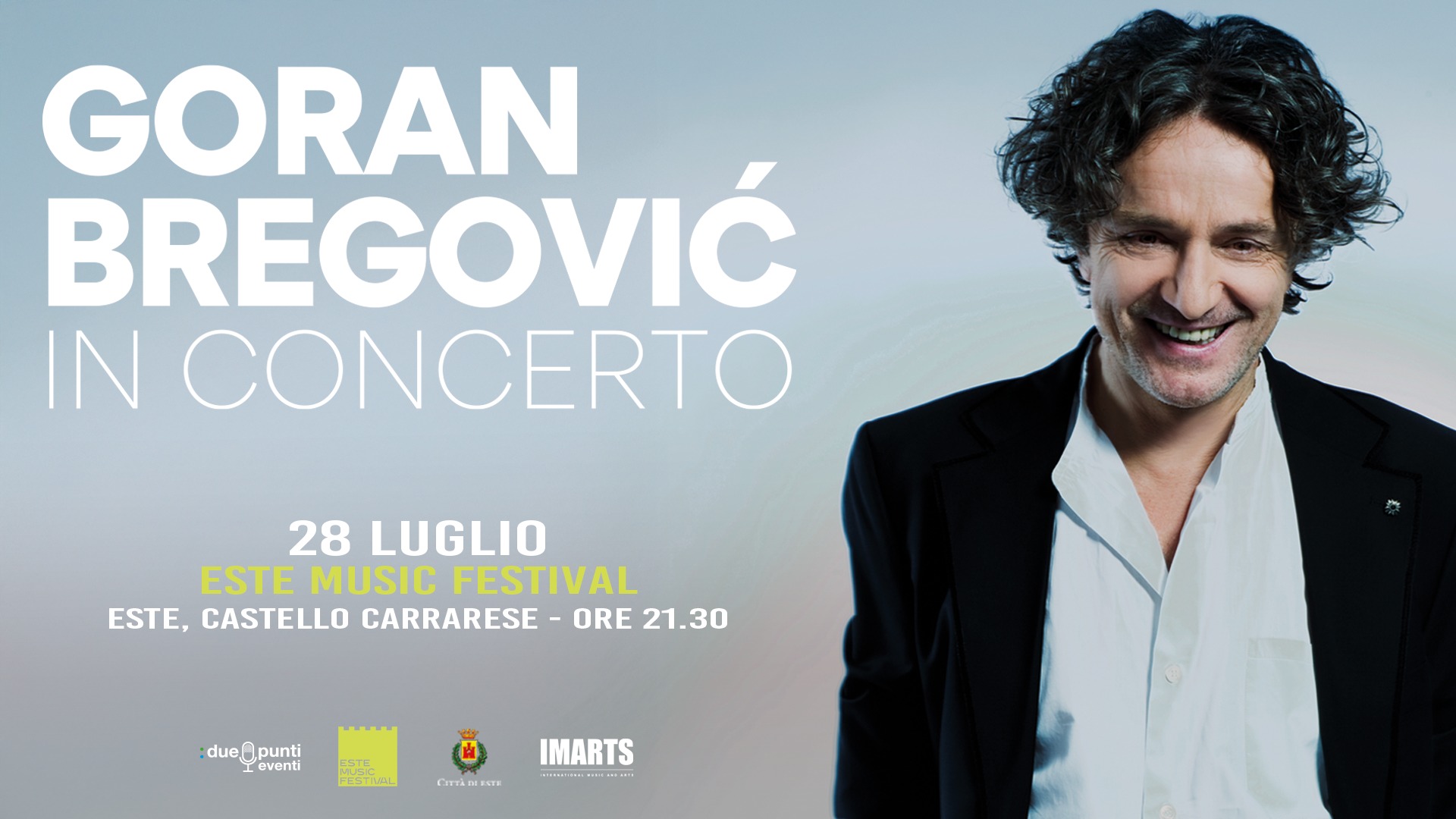 GORAN BREGOVIC May be an image of 1 person, clarinet, trumpet, violin and text that says "GORAN BREGOVIĆ IN CONCERTO 28 LUGLIO ESTE MUSIC FESTIVAL ESTE, CASTELLO CARRARESE ORE 21.30 :due dueMpunti punti eventi IMARTS សាបន់បល. " SIMA"