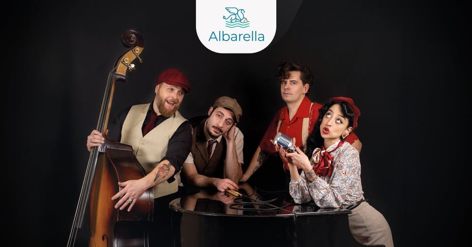 Black Ball Boogie | Isola di Albarella Potrebbe essere un'immagine raffigurante 4 persone, clarinetto, fisarmonica, violino, chitarra e il seguente testo "Albarella WIIN ብብሔ"