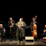 AMERIKAOS Potrebbe essere un'immagine raffigurante pianoforte, violino e clarinetto